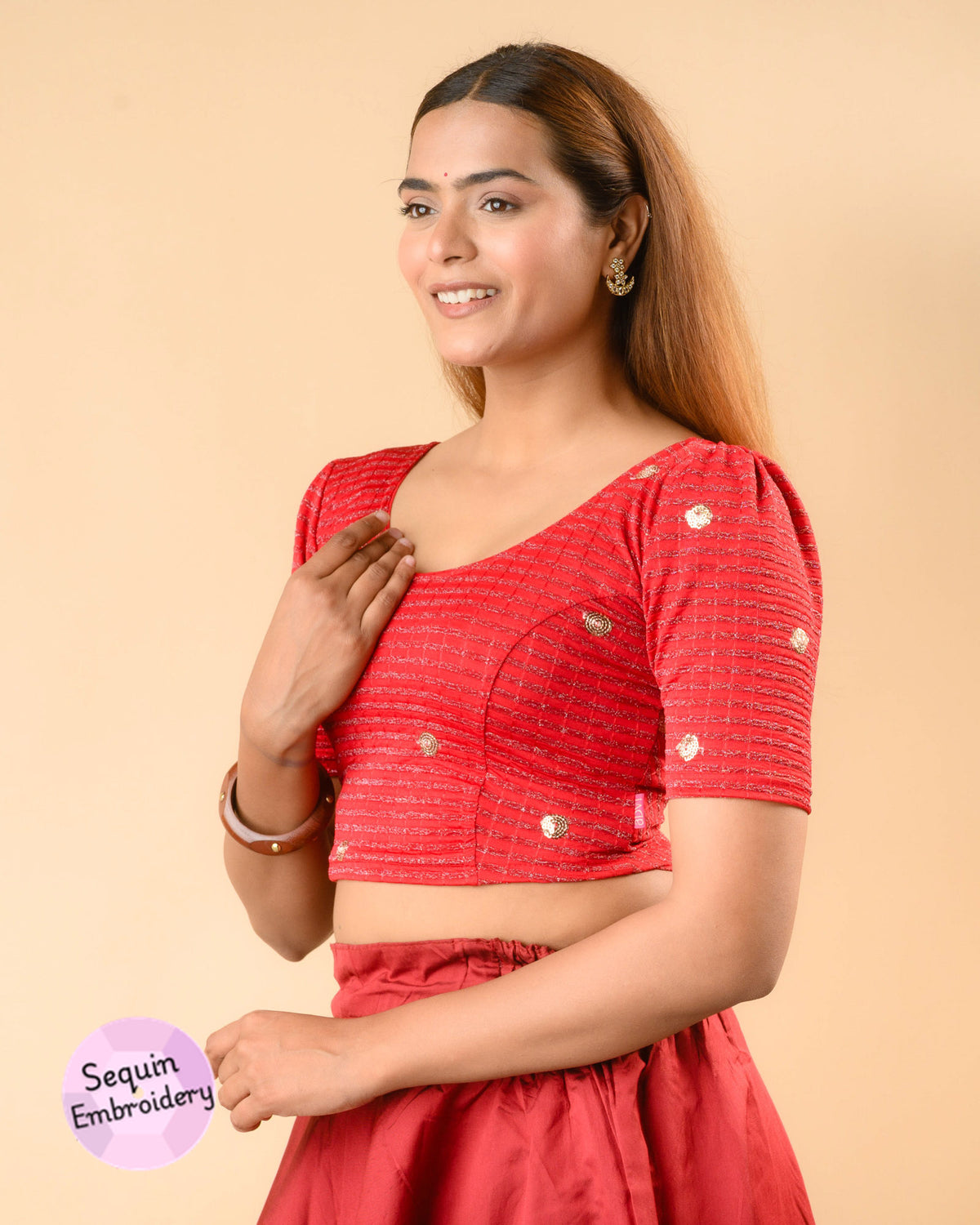 Damini red blouse showing the soft puff sleeve by Advi - side