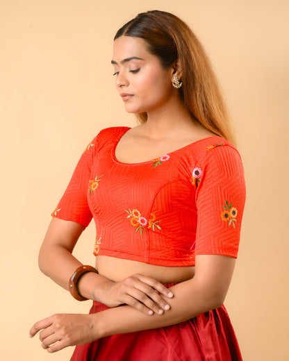Jheeni red blouse side view with mirror work on the elbow sleeves by Advi - side