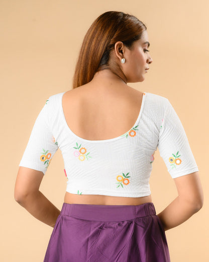 Jheeni white blouse showing the deep U back with floral buti by Advi - back