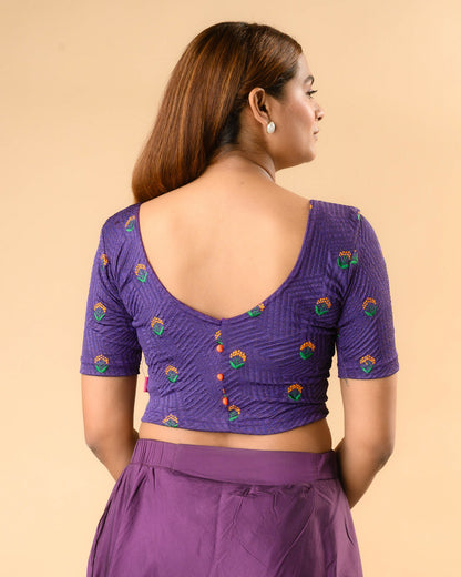 Keerti Purple Resham Buti blouse showing deep V back with orange potli buttons by Advi - back