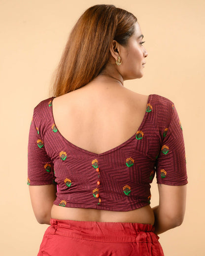 Keerti Wine Embroidered Jacquard blouse showing deep V back with orange potli buttons by Advi - back