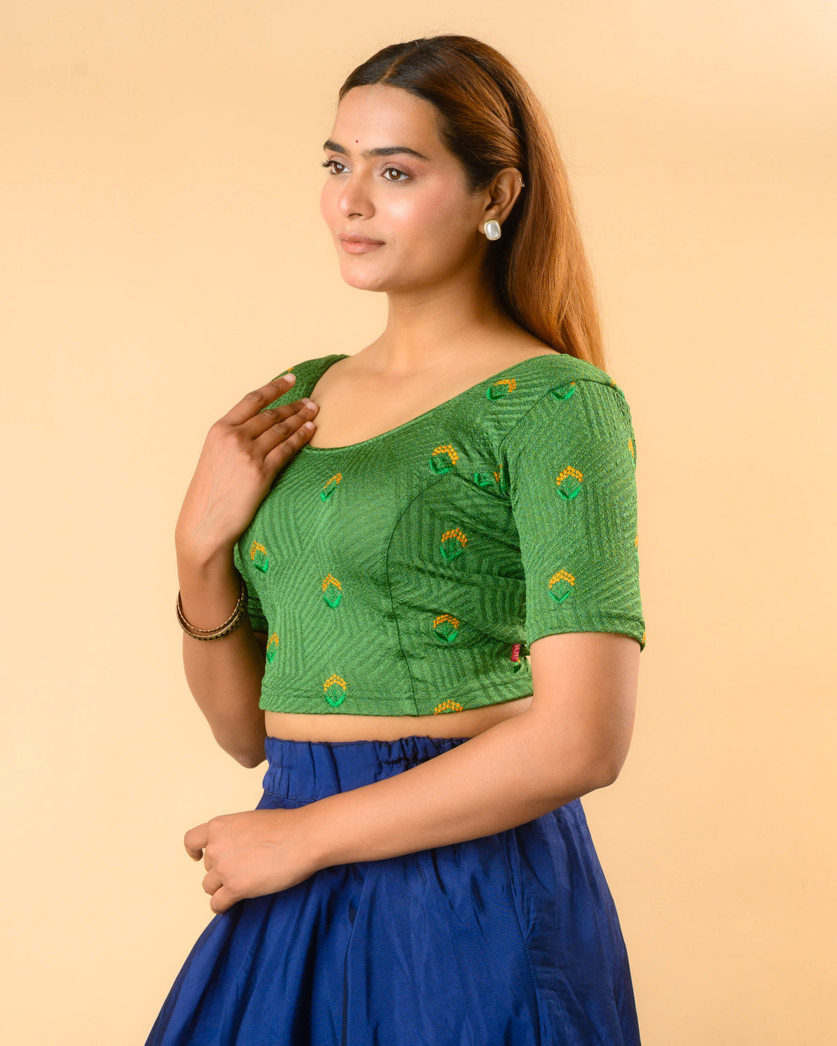 Side view of Keerti Bottle Green stretchable jacquard blouse with elbow sleeves by Advi - side