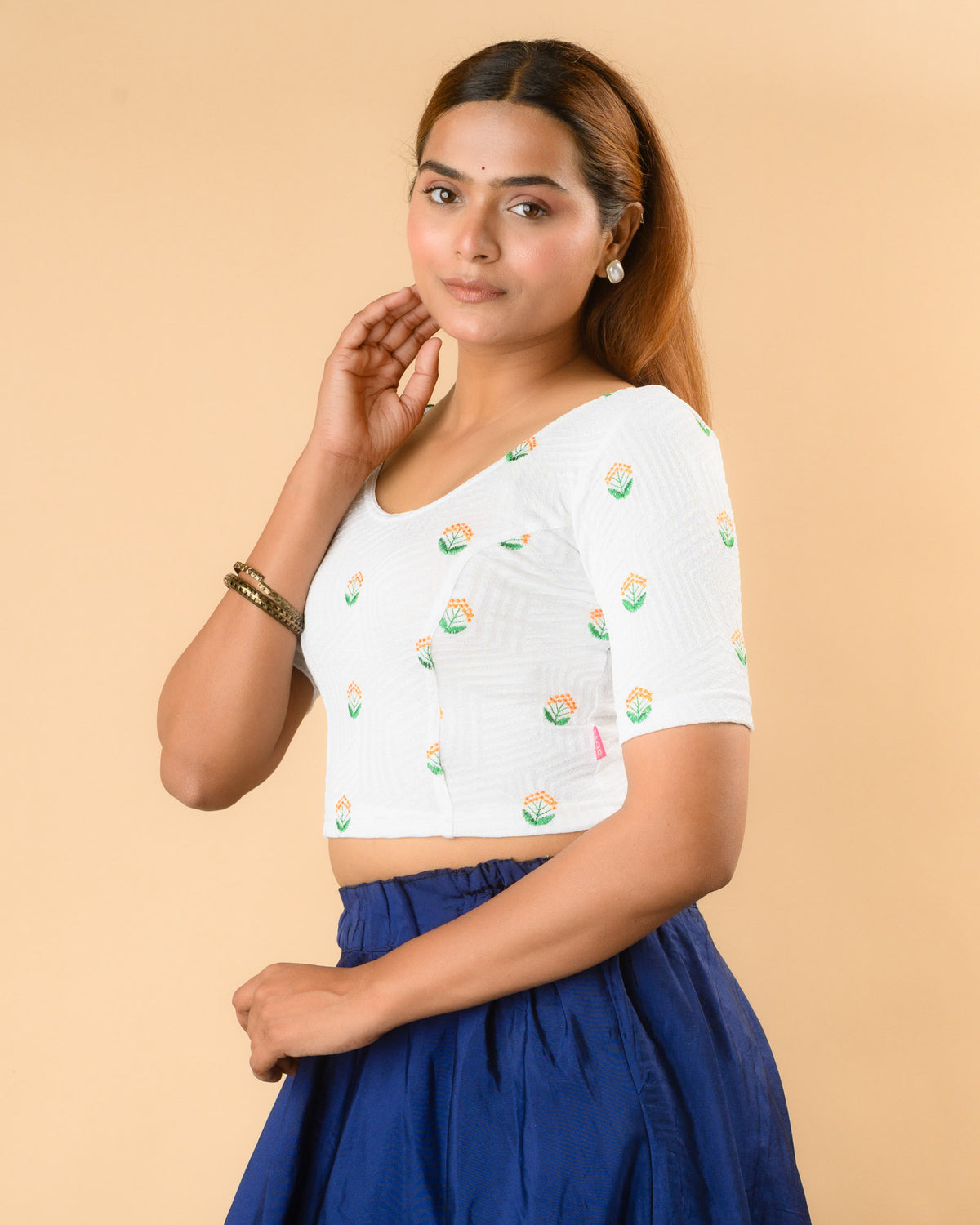 Side view of Keerti White stretchable jacquard blouse with elbow sleeves by Advi - side