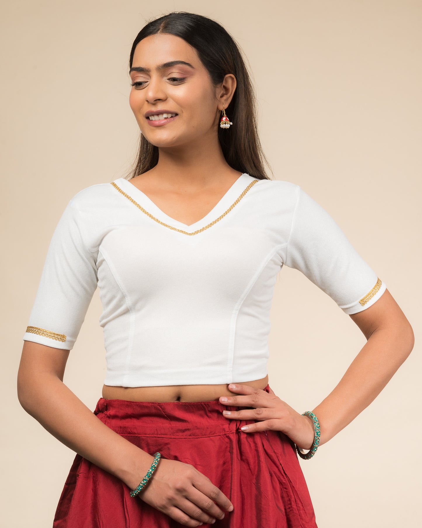 Nohreen Shimmering Solid V Neck Gold Lace Stretchable Slip On Blouse