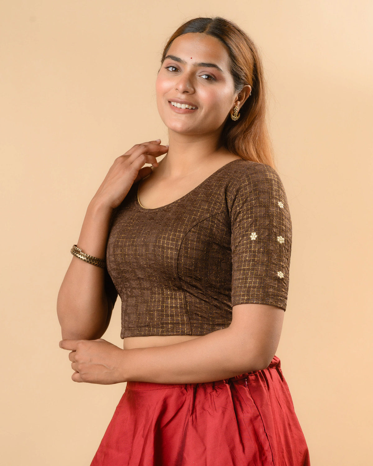 Yamini coffee brown blouse showing elbow sleeves with floral buti embroidery by Advi - side