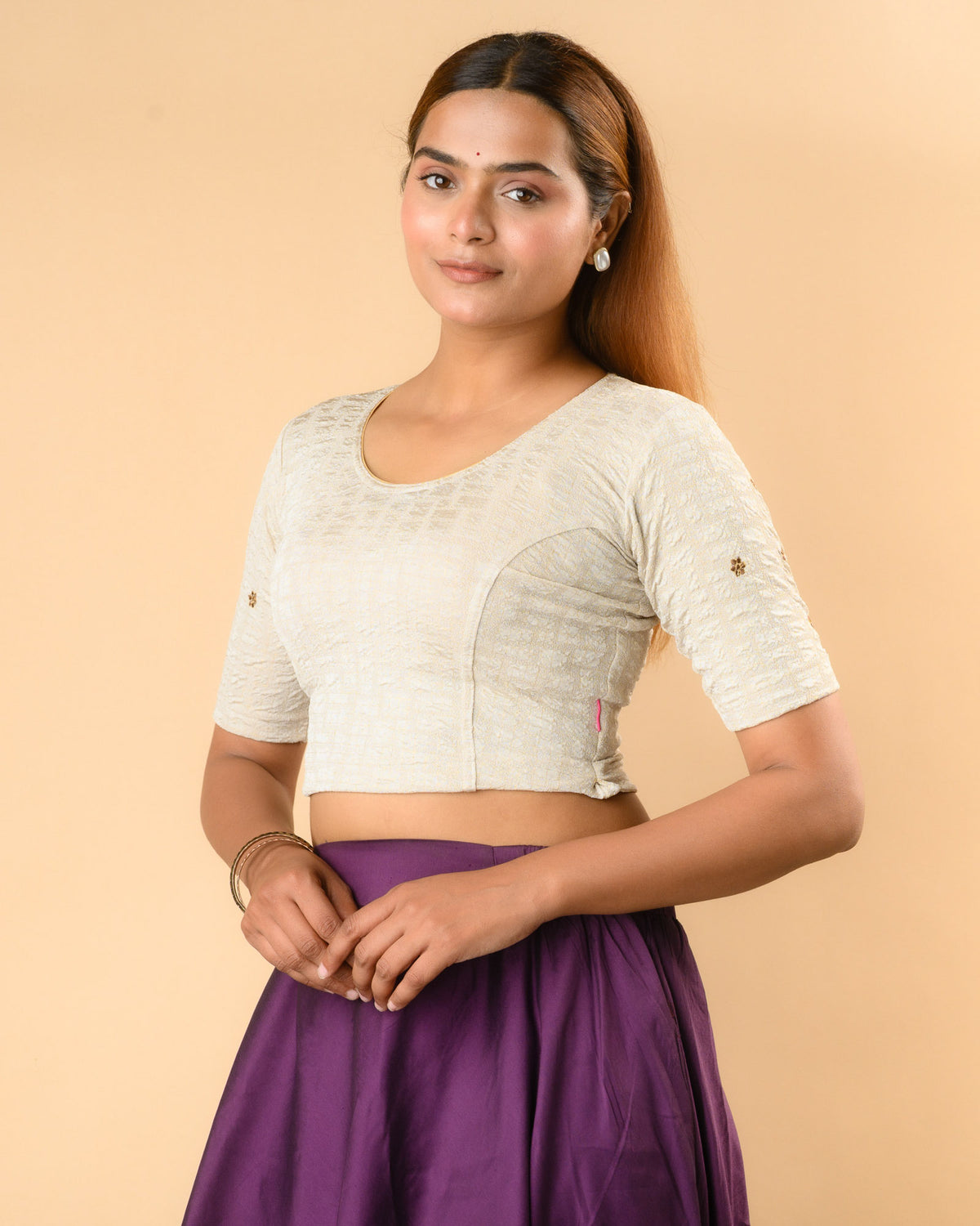 Yamini cream blouse showing elbow sleeves with floral buti embroidery by Advi - side