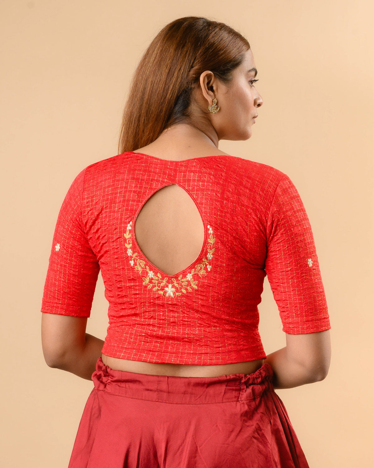 Yamini dark red blouse with teardrop keyhole and gold zari floral border by Advi - back