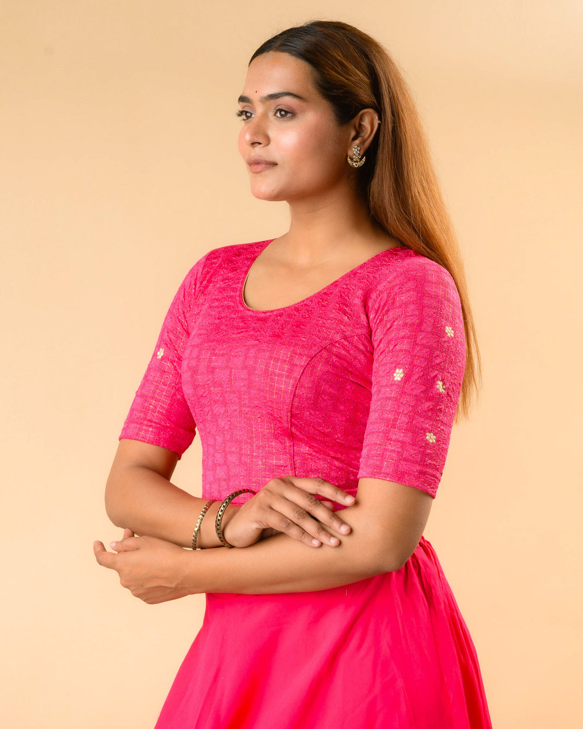 Yamini fuchsia rani blouse showing elbow sleeves with floral buti embroidery by Advi - side