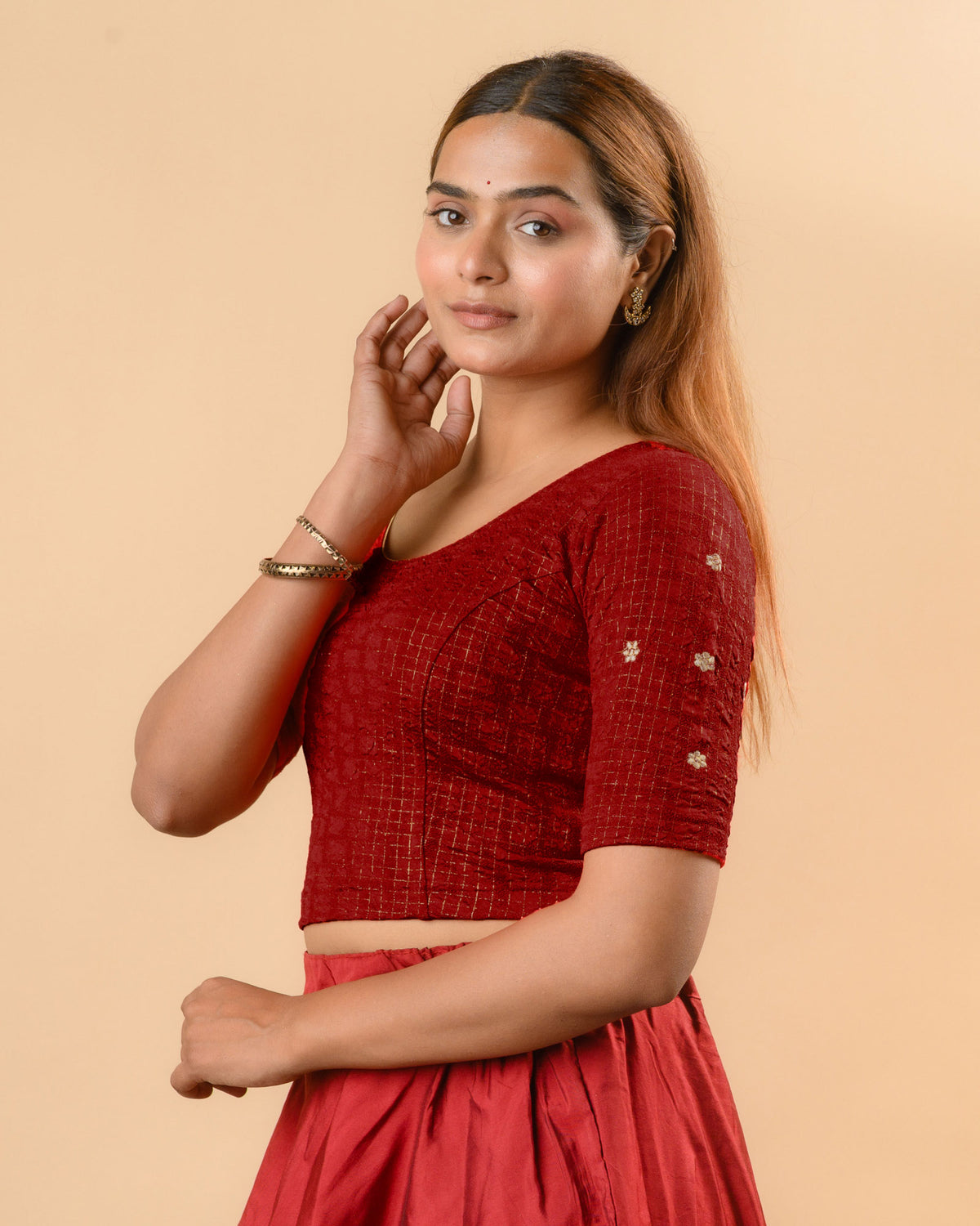Yamini maroon blouse showing elbow sleeves with floral buti embroidery by Advi - side