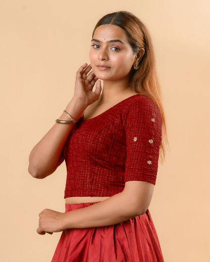 Yamini maroon blouse showing elbow sleeves with floral buti embroidery by Advi - side