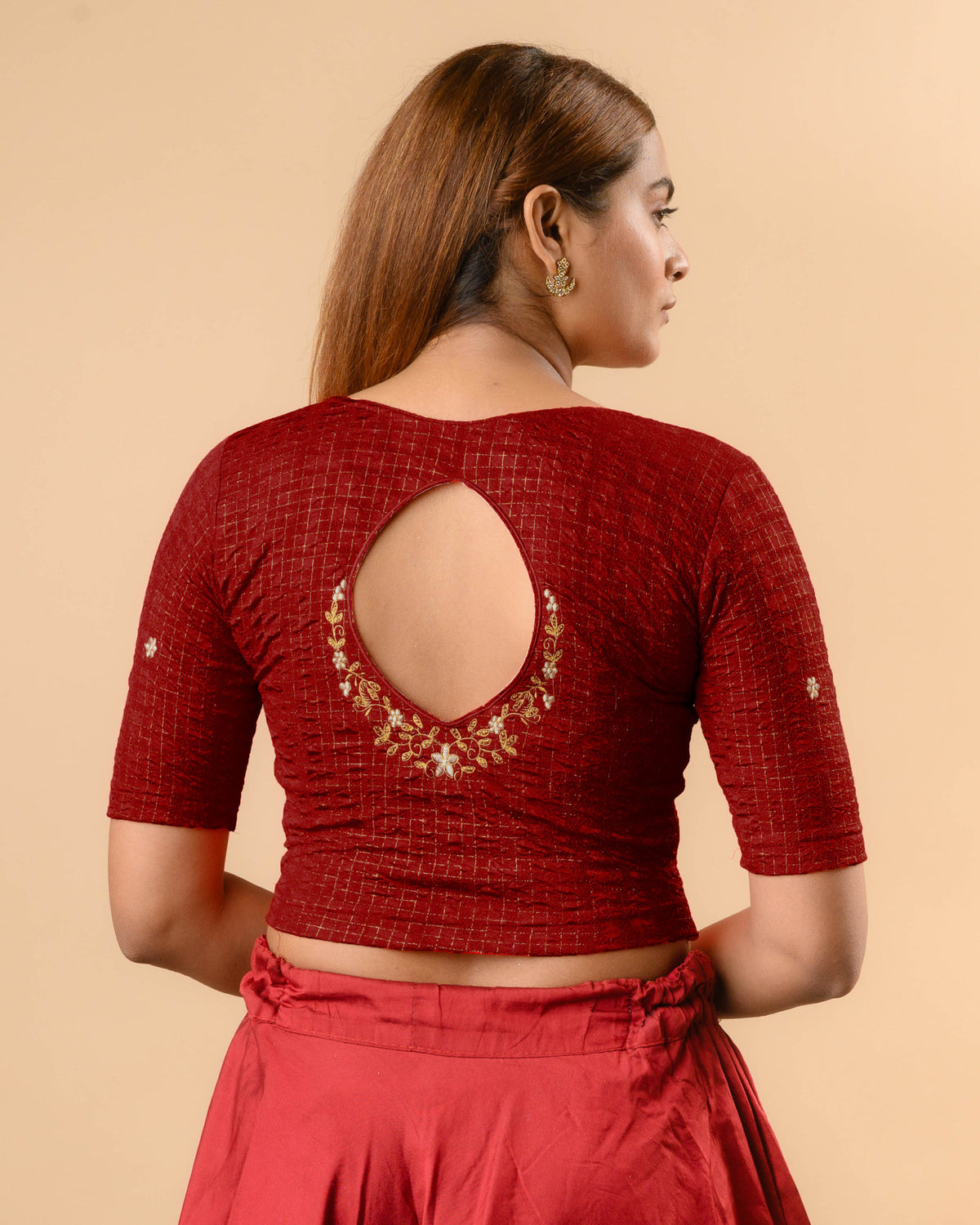 Yamini maroon blouse with teardrop keyhole and gold zari floral border by Advi - back