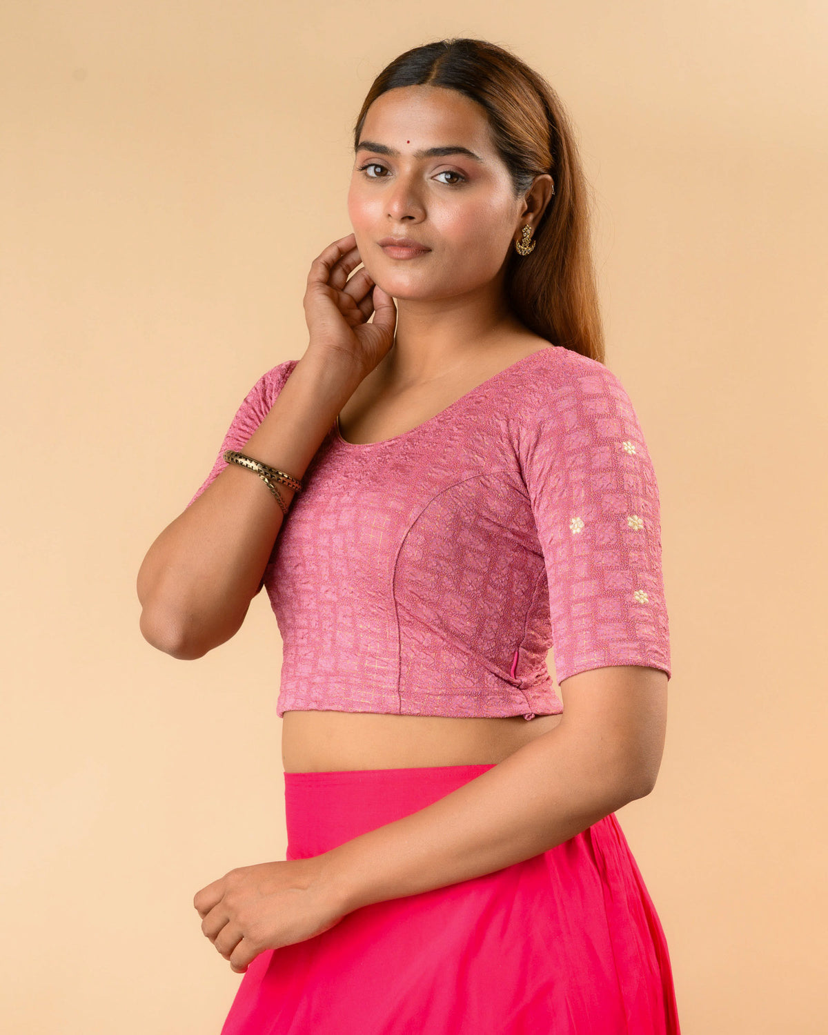 Yamini onion pink blouse showing elbow sleeves with floral buti embroidery by Advi - side