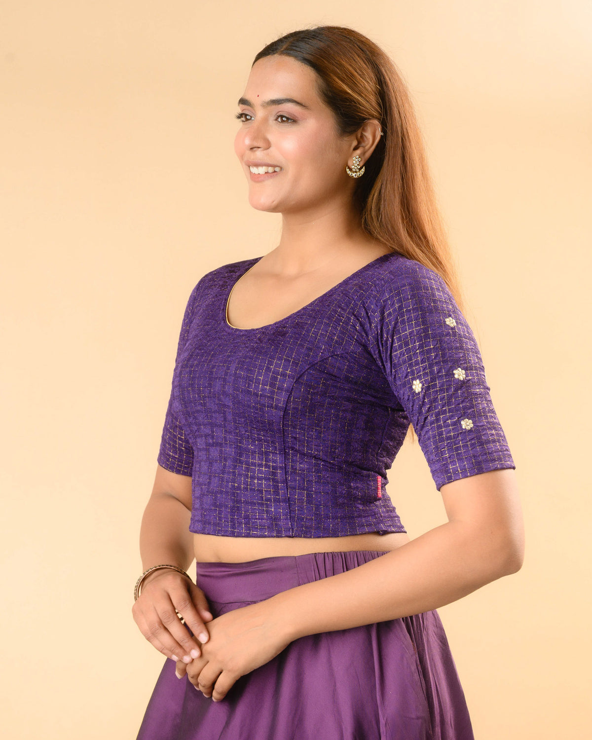 Yamini purple blouse showing elbow sleeves with floral buti embroidery by Advi - side