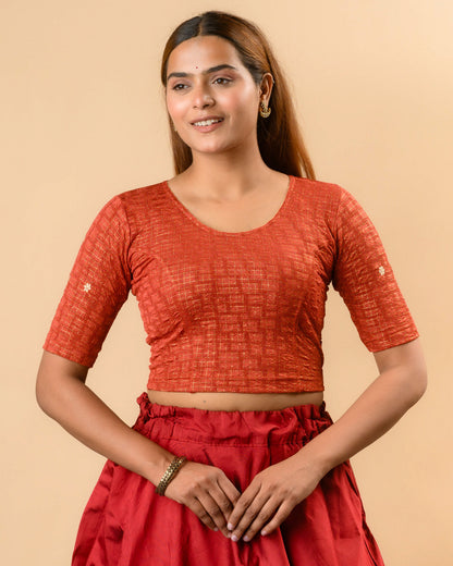 Yamini rust round neck stretch blouse with gold foil checks by Advi - front