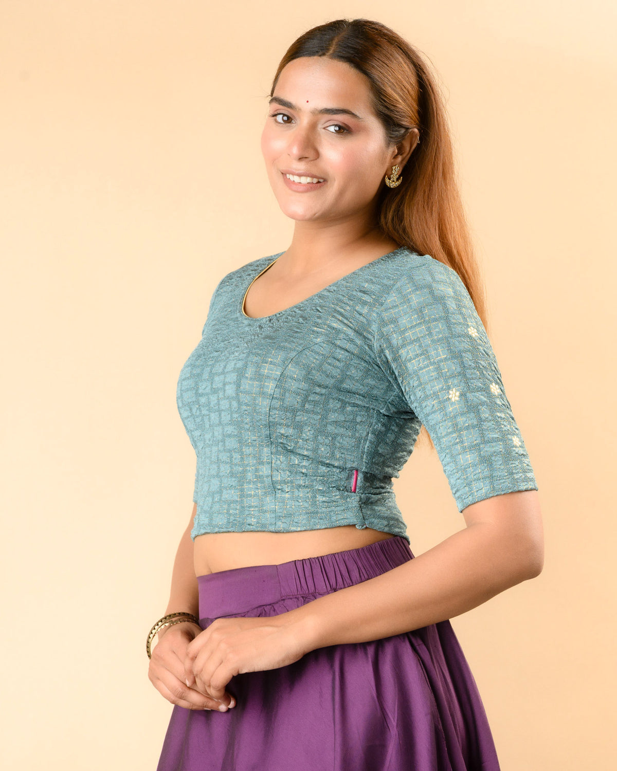 Yamini sea green blouse showing elbow sleeves with floral buti embroidery by Advi - side