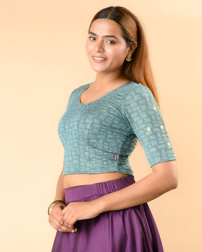 Yamini sea green blouse showing elbow sleeves with floral buti embroidery by Advi - side
