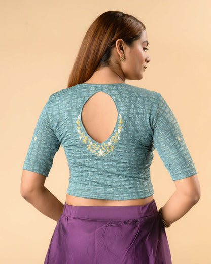 Yamini sea green blouse with teardrop keyhole and gold zari floral border by Advi - back